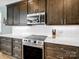 Close-up of the modern kitchen with stainless steel appliances, sleek countertops, and ample cabinetry at 14106 Magnolia Walk Dr, Huntersville, NC 28078