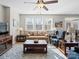 Inviting living room with natural light, wood floors, and comfortable seating at 14106 Magnolia Walk Dr, Huntersville, NC 28078