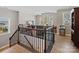 Upstairs living area with view of downstairs, wood floors and natural light at 14106 Magnolia Walk Dr, Huntersville, NC 28078