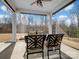 Covered patio features a table and chairs with view of green backyard at 14106 Magnolia Walk Dr, Huntersville, NC 28078