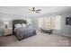 Spacious bedroom with a large bed and window at 174 Country Lake Dr, Mooresville, NC 28115