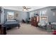 Bright bedroom featuring a bed, desk and window at 174 Country Lake Dr, Mooresville, NC 28115