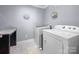 Convenient laundry room with washer, dryer, and granite countertop at 174 Country Lake Dr, Mooresville, NC 28115