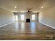 Spacious living room with hardwood floors, fireplace, and ceiling fan at 174 Swann Rd # 3, Statesville, NC 28625