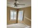 Bright bedroom with window shutters and patterned wallpaper at 1915 Pleasant Hill Church Rd, Shelby, NC 28152