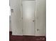 Simple hallway with white door and burgundy carpet at 1915 Pleasant Hill Church Rd, Shelby, NC 28152