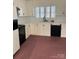 Kitchen with white cabinets and black appliances at 1915 Pleasant Hill Church Rd, Shelby, NC 28152