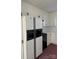 White kitchen with black appliances and fridge at 1915 Pleasant Hill Church Rd, Shelby, NC 28152