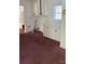 Laundry room with white cabinets and burgundy carpet at 1915 Pleasant Hill Church Rd, Shelby, NC 28152