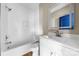 Modern bathroom with white subway tile surround, a tub, and a vanity with an illuminated mirror at 211 Benfield Rd, Kings Mountain, NC 28086