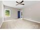 Large bedroom with ceiling fan, carpet and natural light at 211 Benfield Rd, Kings Mountain, NC 28086
