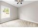 Cozy bedroom with carpet and window, offering natural light and a ceiling fan at 211 Benfield Rd, Kings Mountain, NC 28086