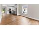Spacious living room open to the kitchen, featuring hardwood floors and natural light at 211 Benfield Rd, Kings Mountain, NC 28086