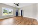 Inviting living room with hardwood floors, large windows, and a stylish blue front door at 211 Benfield Rd, Kings Mountain, NC 28086