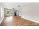 Large living room with hardwood floors, bright windows and a ceiling fan at 211 Benfield Rd, Kings Mountain, NC 28086