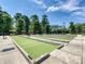 Well-maintained bocce ball courts surrounded by lush landscaping and benches, perfect for community gatherings at 21222 W Tern Ct, Fort Mill, SC 29707