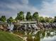 Scenic entrance to Sun City Carolina Lakes community with waterfall and lush greenery at 21222 W Tern Ct, Fort Mill, SC 29707