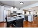 Spacious kitchen featuring stainless steel appliances, white cabinetry, and a breakfast nook at 21222 W Tern Ct, Fort Mill, SC 29707