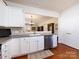 Modern kitchen showcasing a stainless steel dishwasher and an open layout to the dining space at 21222 W Tern Ct, Fort Mill, SC 29707