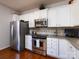 Modern kitchen showcasing stainless steel appliances and white cabinetry at 21222 W Tern Ct, Fort Mill, SC 29707