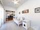 Bright living area featuring tile floors and white furniture with a view of the kitchen at 21222 W Tern Ct, Fort Mill, SC 29707