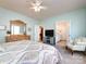 Comfortable main bedroom with ensuite bathroom, carpet, and ceiling fan at 21222 W Tern Ct, Fort Mill, SC 29707