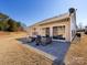 Back patio with outdoor seating and awning to beat the sun at 21222 W Tern Ct, Fort Mill, SC 29707