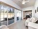 Bright sunroom featuring tile floors and sliding glass doors leading to an outdoor patio at 21222 W Tern Ct, Fort Mill, SC 29707