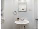 Small bathroom with pedestal sink and a mirror at 225 Spencer St, Rock Hill, SC 29730