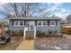 Gray house with white trim, steps, landscaping, and a walkway at 225 Spencer St, Rock Hill, SC 29730