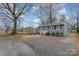 Gray house with gravel driveway, visible yard, and a tree at 225 Spencer St, Rock Hill, SC 29730