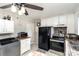 White kitchen with stainless steel appliances and laundry area at 225 Spencer St, Rock Hill, SC 29730