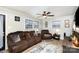 Living room with brown couches, a TV, and a wood accent wall at 225 Spencer St, Rock Hill, SC 29730