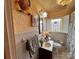 Bathroom featuring a stained glass window, white tile, and modern fixtures at 225 Wilson St, Albemarle, NC 28001