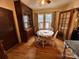 Bright dining room with hardwood floors, built-in cabinet, and a round dining table at 225 Wilson St, Albemarle, NC 28001