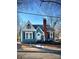 Charming teal home with a gabled roof and manicured lawn at 225 Wilson St, Albemarle, NC 28001