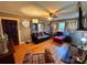 Comfortable living room featuring hardwood floors, an area rug, a couch, and an ottoman at 225 Wilson St, Albemarle, NC 28001