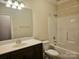 Bathroom with vanity, tub, and toilet at 240 Harrison Ln, Locust, NC 28097