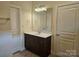 Bathroom with vanity and a large mirror at 240 Harrison Ln, Locust, NC 28097