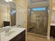 Bathroom with tiled shower and double vanity at 240 Harrison Ln, Locust, NC 28097