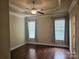 Spacious bedroom with hardwood floors and ceiling fan at 240 Harrison Ln, Locust, NC 28097