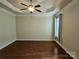 Bright bedroom with hardwood floors and ceiling fan at 240 Harrison Ln, Locust, NC 28097