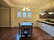 Bright dining room with hardwood floors and a chandelier at 240 Harrison Ln, Locust, NC 28097