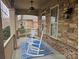 Inviting front porch with rocking chairs and a blue rug at 240 Harrison Ln, Locust, NC 28097