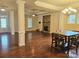 Open living area with hardwood floors, stone fireplace and high ceilings at 240 Harrison Ln, Locust, NC 28097