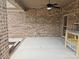 Covered patio with brick and ceiling fan at 240 Harrison Ln, Locust, NC 28097