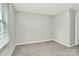 Modest bedroom featuring a window with blinds, neutral paint, and carpeted floor at 2520 Lower Stone Church Rd, Rockwell, NC 28138