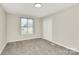 Neutral bedroom features one window, carpet, and closet at 2520 Lower Stone Church Rd, Rockwell, NC 28138