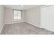 Neutral bedroom features one window, carpet, and closet at 2520 Lower Stone Church Rd, Rockwell, NC 28138