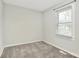 Neutral bedroom featuring carpeted floor, window with blinds and neutral paint at 2520 Lower Stone Church Rd, Rockwell, NC 28138